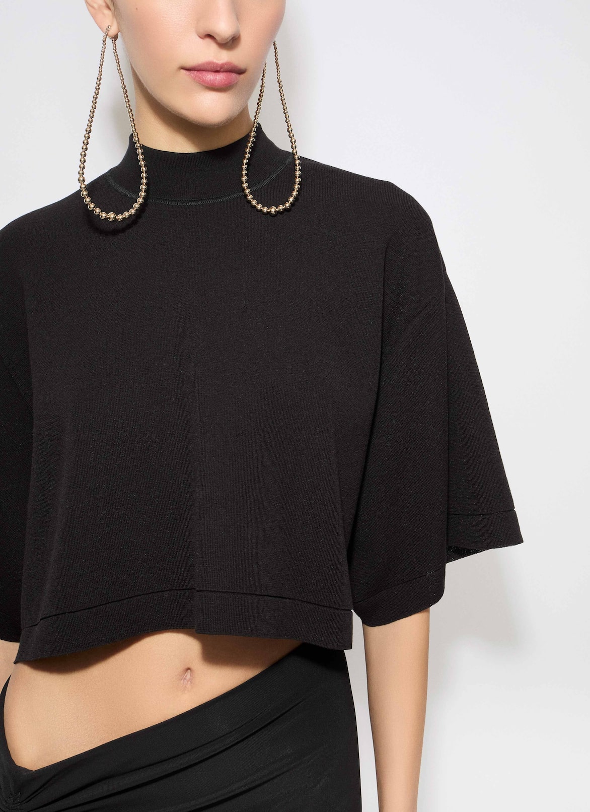 KNITTED CROPPED T-SHIRT ALAÏA BLACK KNITTED CROPPED T-SHIRT